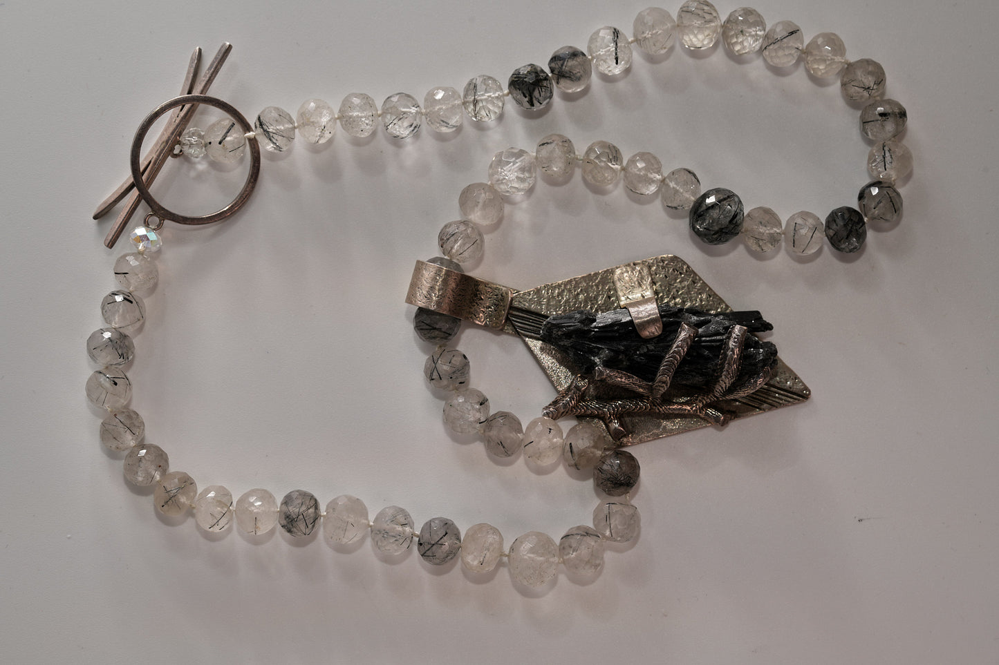 Rutiliated quartz with Kyanite pendant