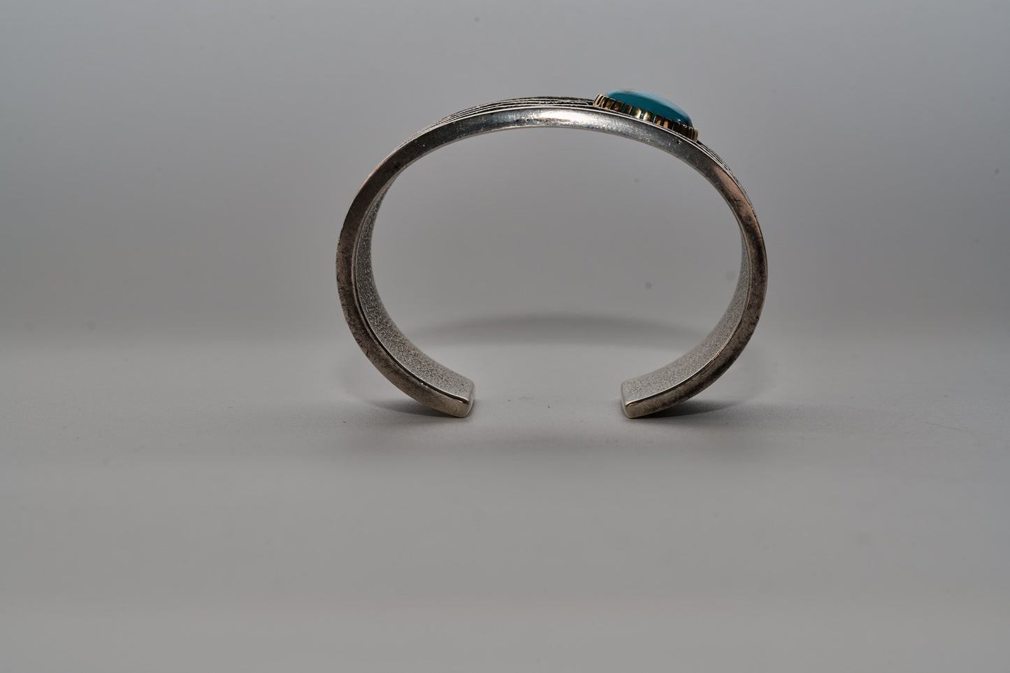 Tufa cast, 18kt,sterling silver and turquoise bracelet