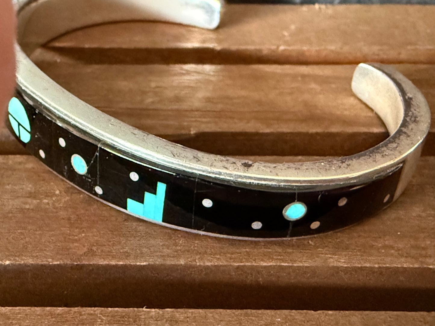 Modern surface motif with background, Calvin Begay, Navajo, handcrafted bracelet.
