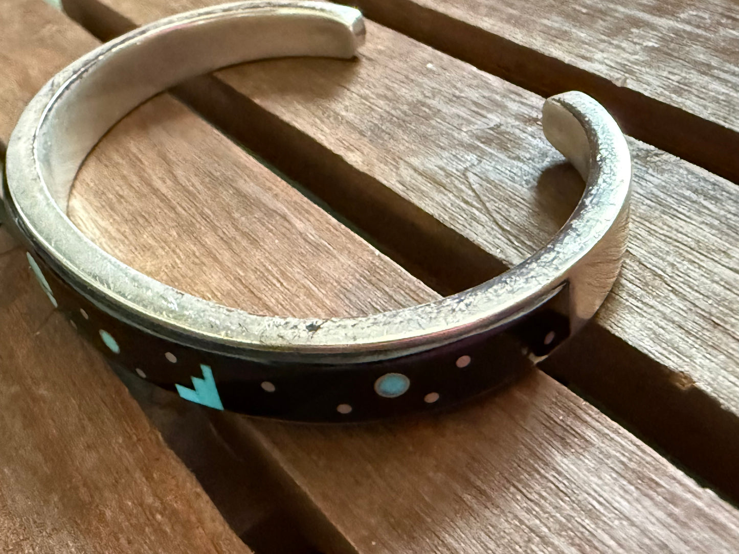 Modern surface motif with background, Calvin Begay, Navajo, handcrafted bracelet.