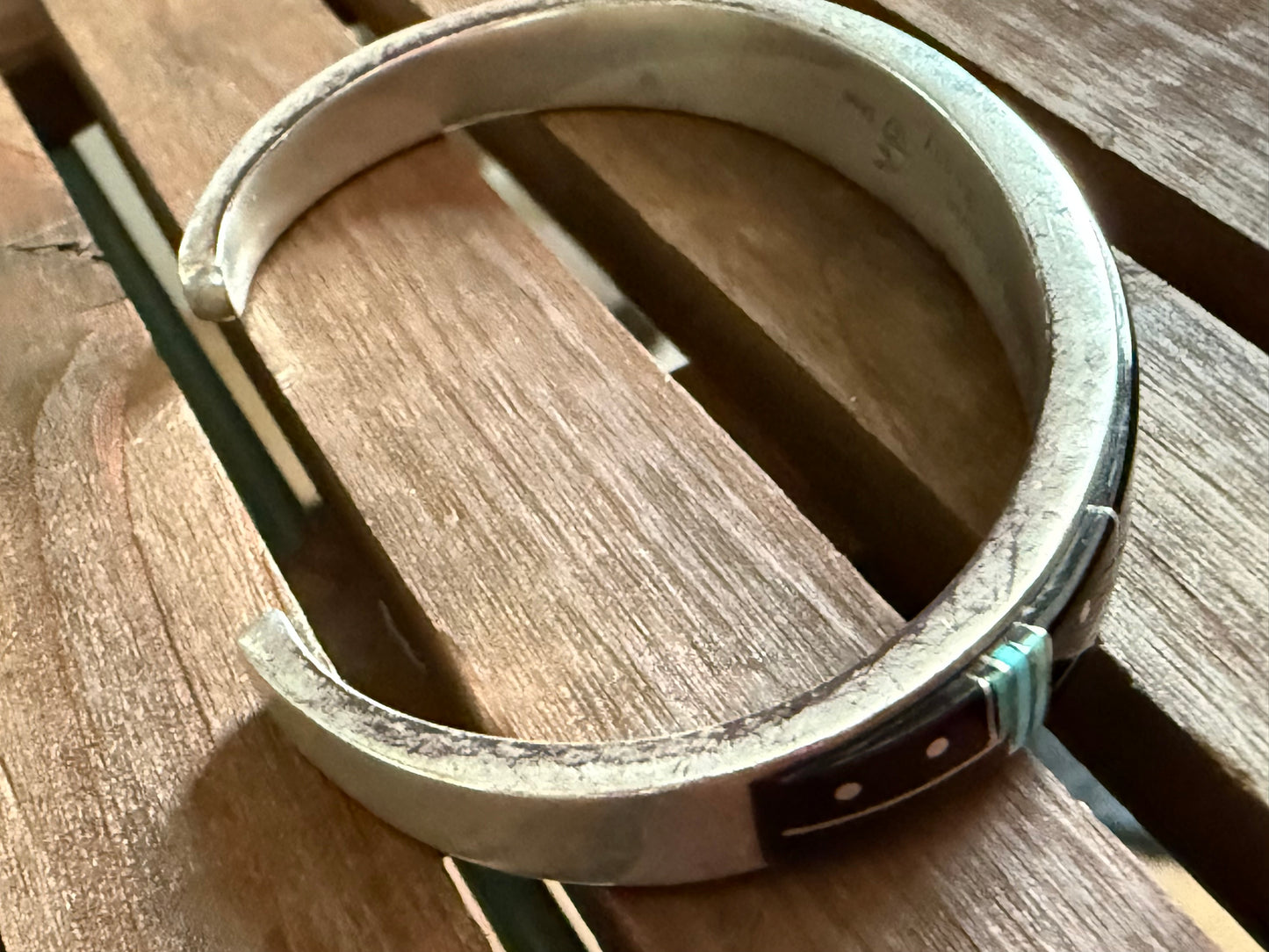 Modern surface motif with background, Calvin Begay, Navajo, handcrafted bracelet.