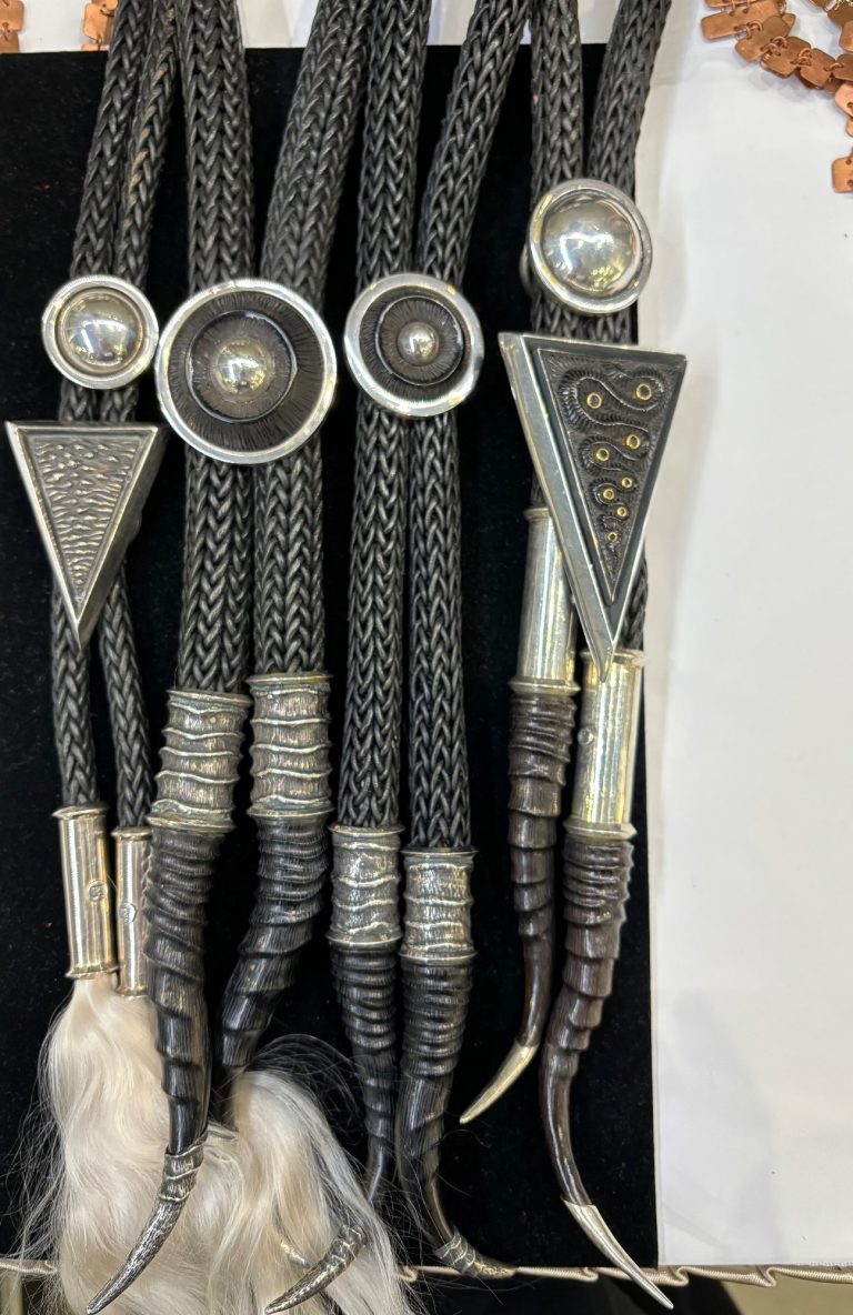 So unique, alpaca hair, sterling, handwoven straps, carved horn Oh my Gosh, hand woven, carved horn, bolos